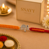 Premium Silver Shiv Rakhi with Handwoven Red Orange Thread