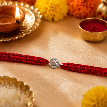 Premium Silver Om Rakhi with CZ Stone & Adjustable Red Thread