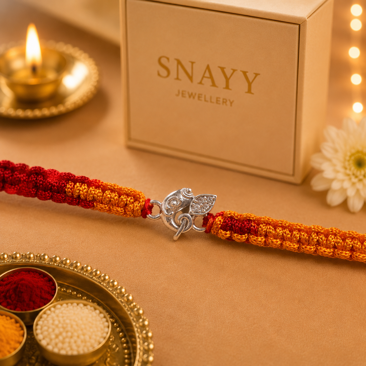 Premium Silver Ganesh Rakhi with CZ Stone & Handwoven Red Yellow Thread