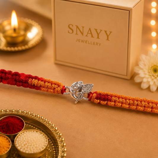 Premium Silver Ganesh Rakhi with CZ Stone & Handwoven Red Yellow Thread