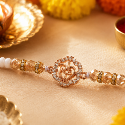 Gold Finish Om Rakhi with Pearl Beads