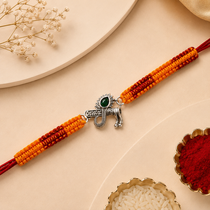 Silver Trishul Damru Rakhi with Green Stone