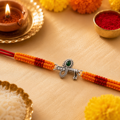 Silver Trishul Damru Rakhi with Green Stone