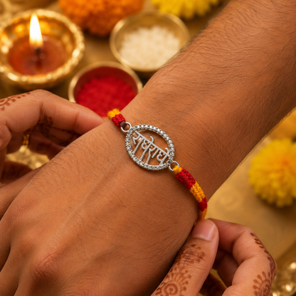 Silver Radhe Radhe Rakhi with Stone Border