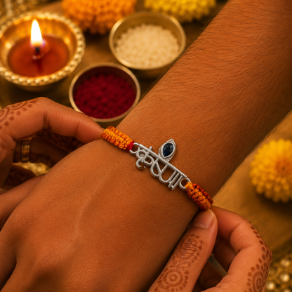 Premium Silver Krishna Rakhi with Blue Stone & Handwoven Thread